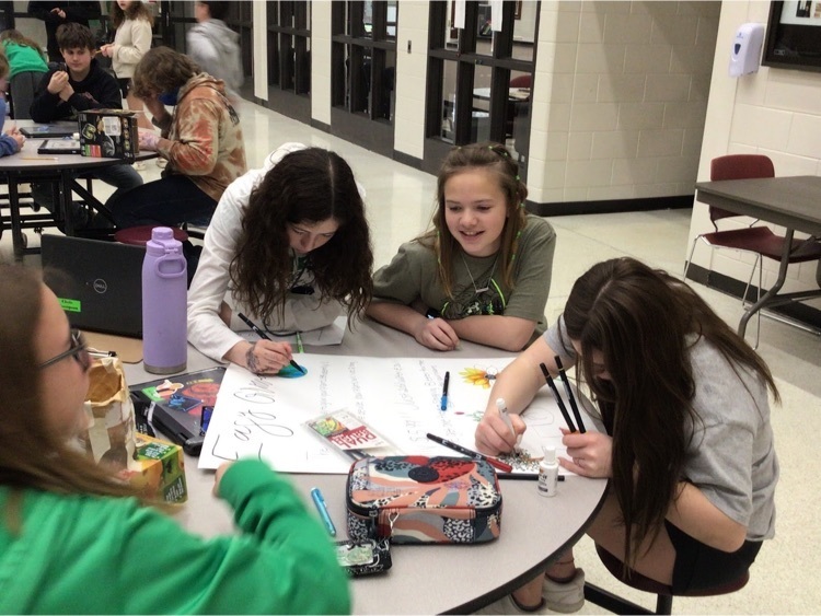 Students creating a poster